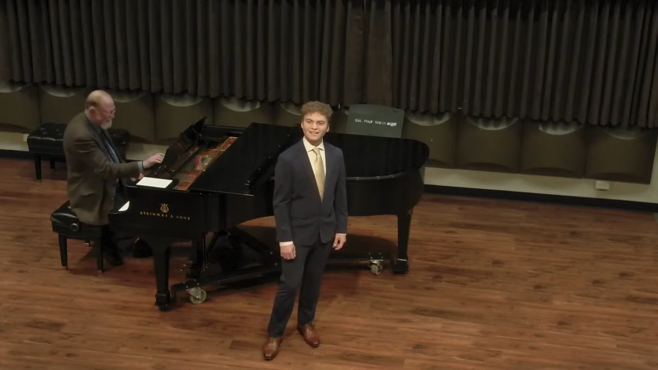Student dressed all black at vocal recital